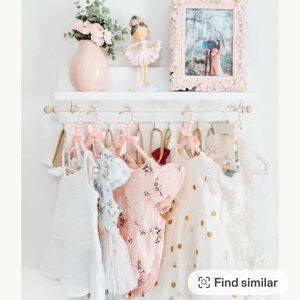 Adorable Nursery bow and clothing rod and shelf for baby girl rooms!